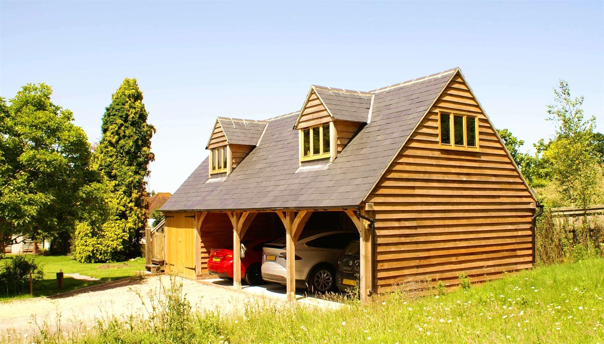 4 Bay Oak Framed Garage Featuring Two Dormer Windows on First Floor