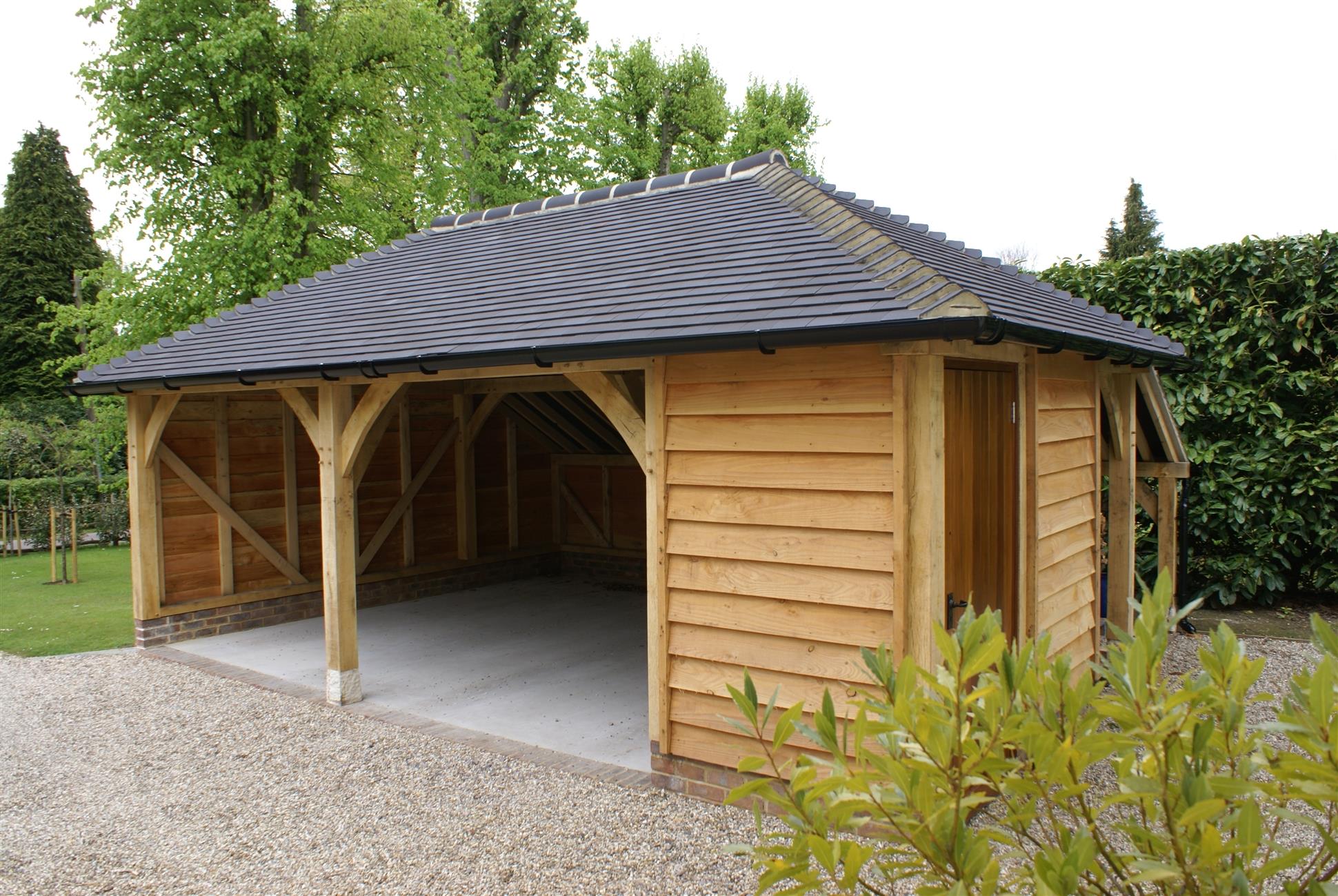 Two and a Half Bay Garage Featuring Larch Weatherboarding